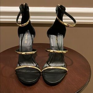 Bebe Black and Gold Stiletto Heels